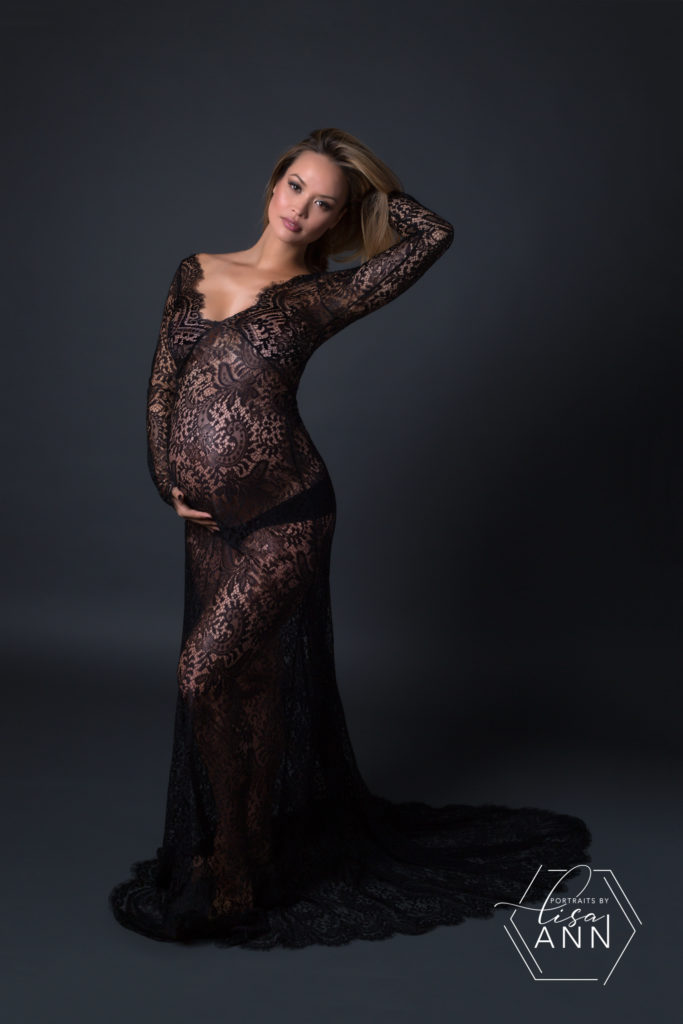 gorgeous pregnancy portrait of woman in black lace dress