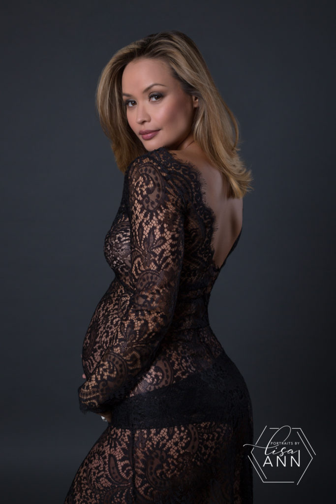 gorgeous pregnant woman in black lace gown