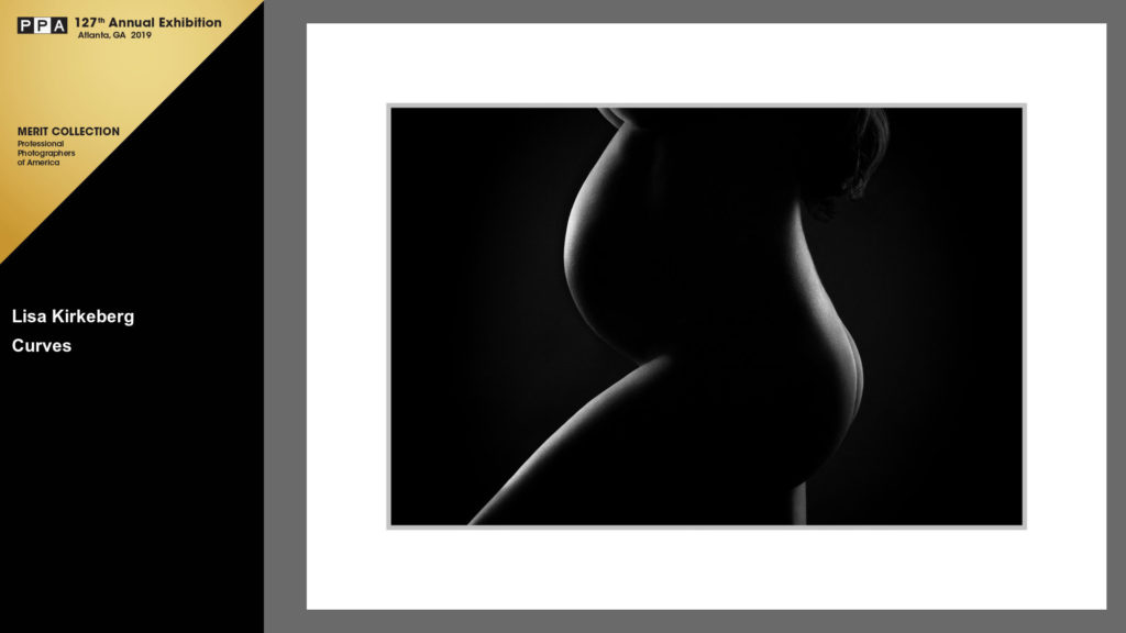 black and white photo of pregnant woman's belly, bottom, and leg