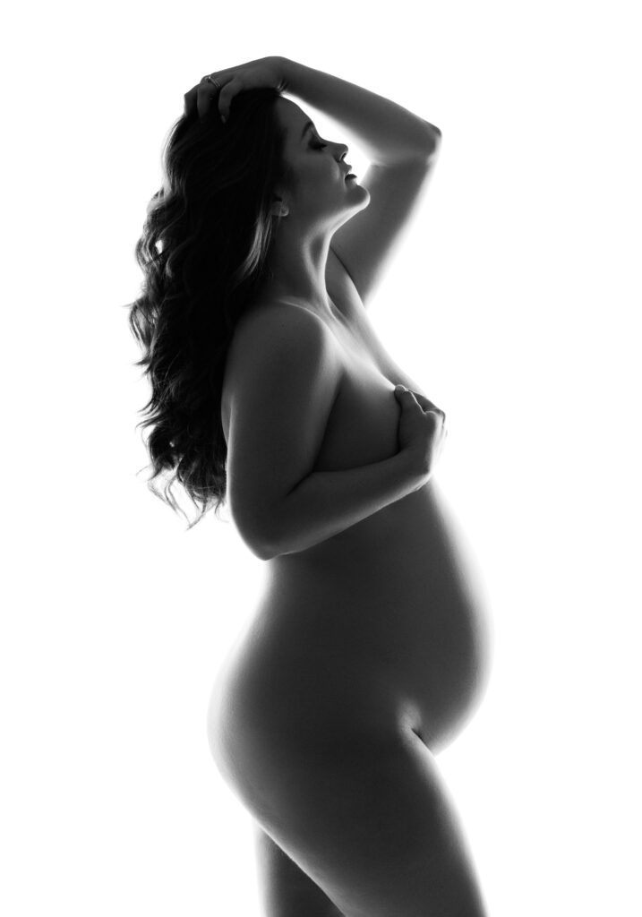 black and white silhouette of maternity belly