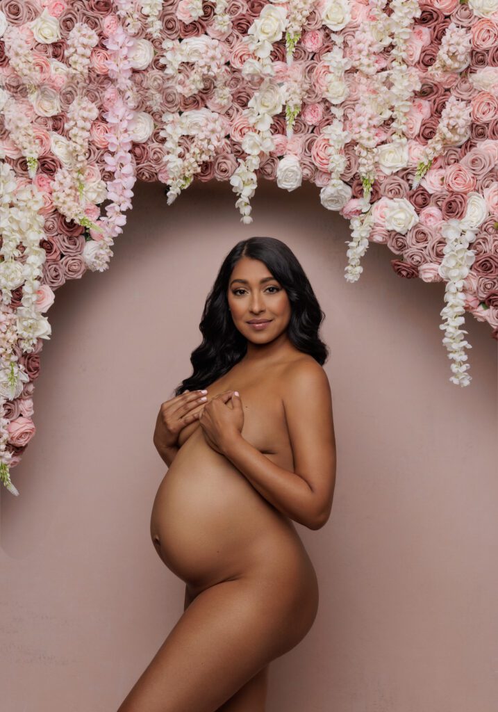 maternity shoot with floral background in studio