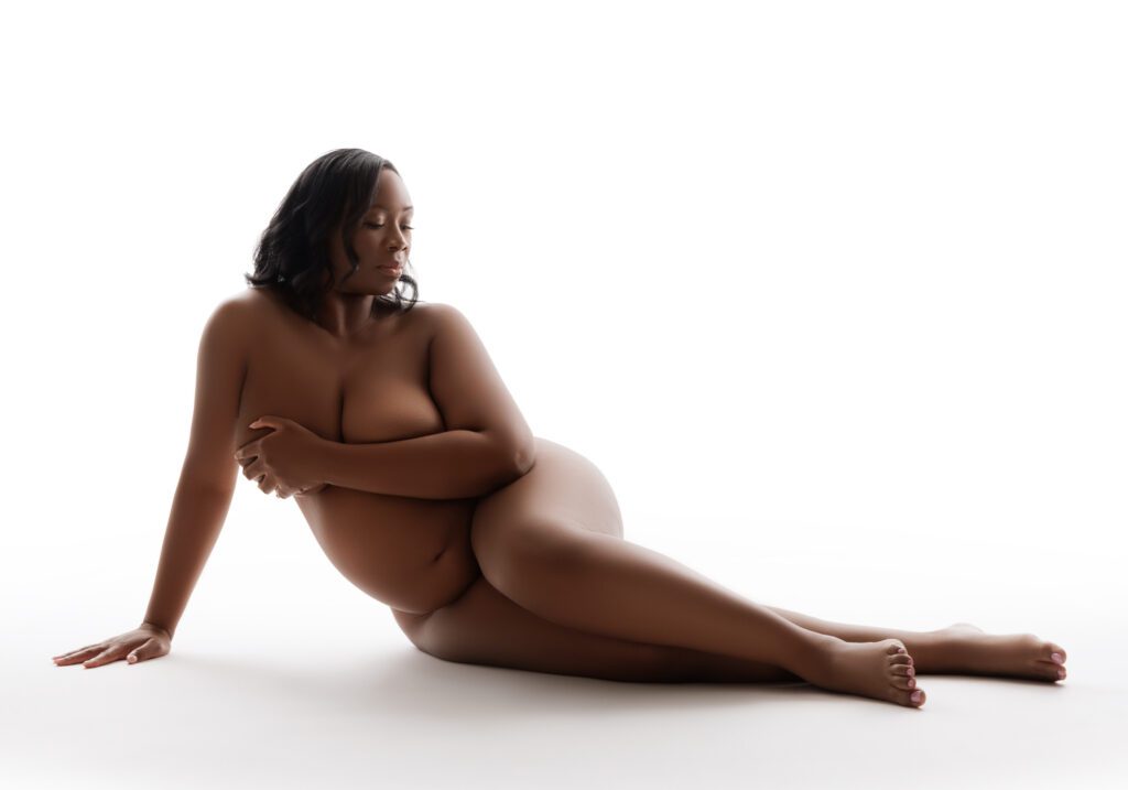 nude maternity shoot in studio with white background