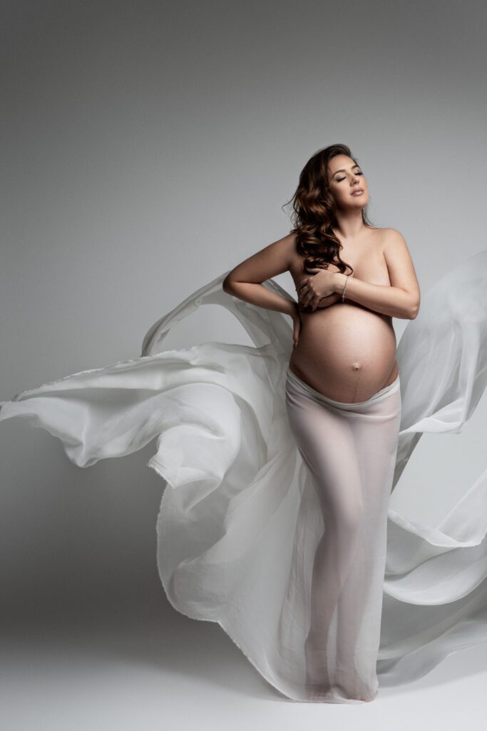 woman posing with white silk thrown