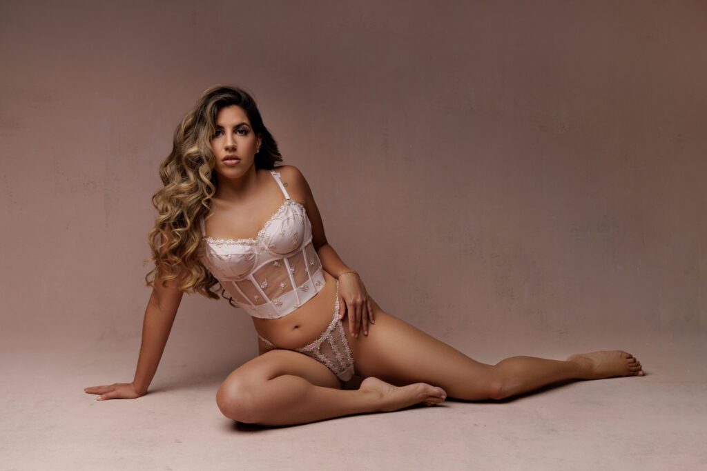 boudoir photograph of woman in pink lace